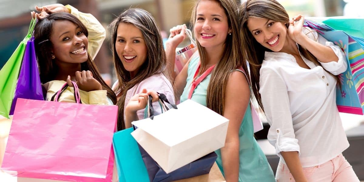 women holding shopping bags