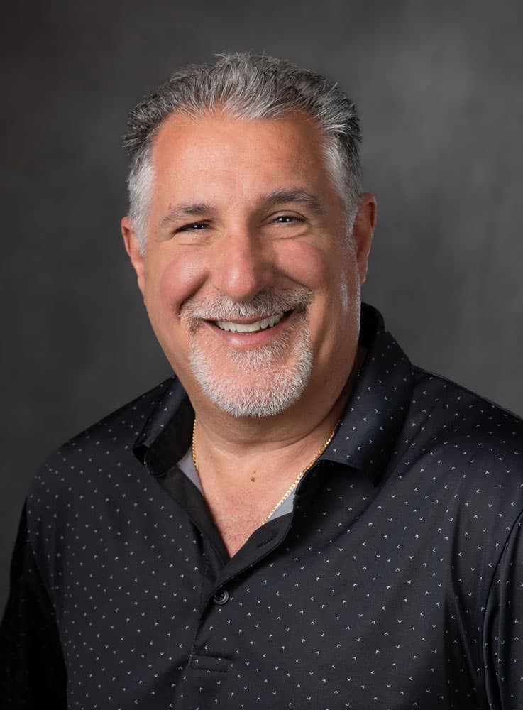 A photograph of Eric Manno