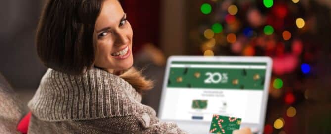 woman looking at computer showing gift cards om sale