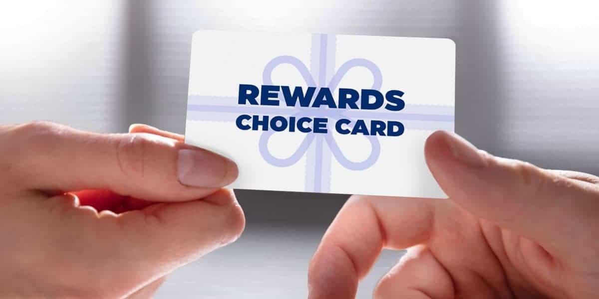 person handing a physical egifter rewards choice card to another person