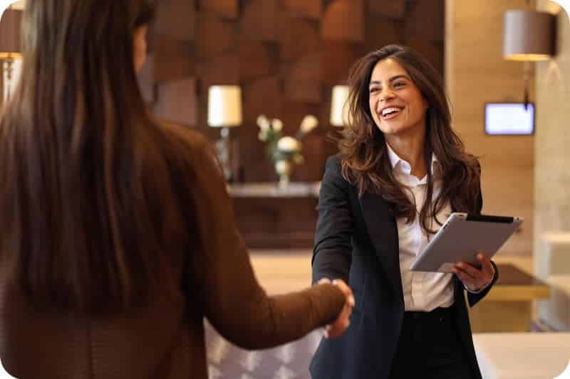Travel Industry A photo of a hotel employee greeting a guest